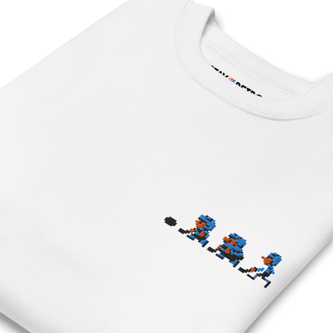 White t-shirt with pixelated character design and 'Mii Fighter' text on a white background