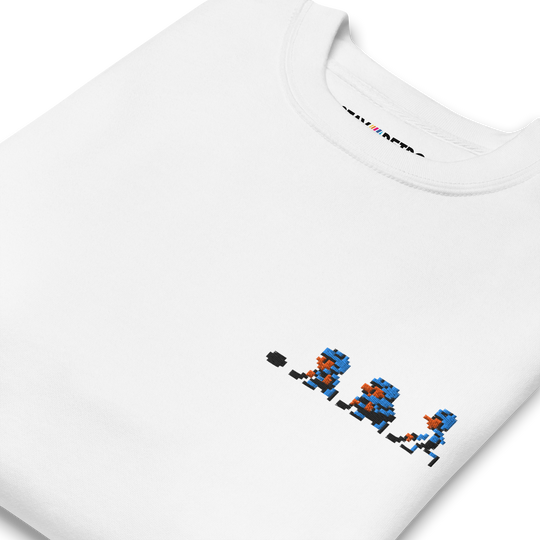 White t-shirt with pixelated character design and 'Mii Fighter' text on a white background